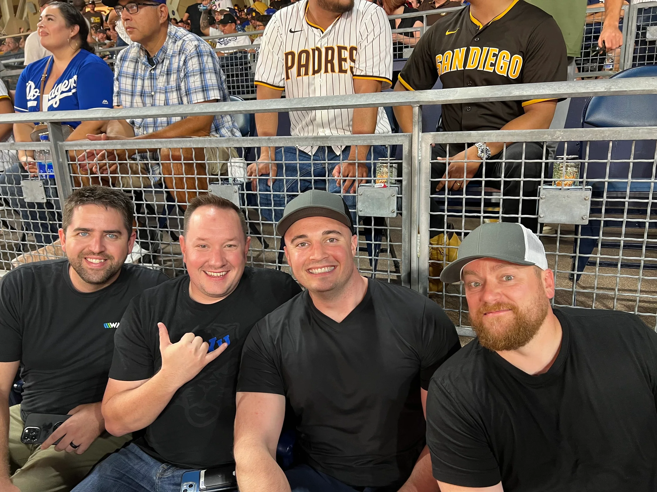Clients Ethan and Robert with founders Chad and Curtis at a ballgame